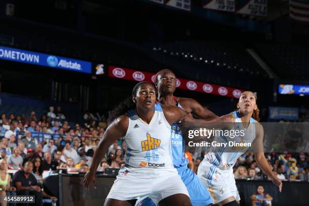 Sasha Goodlett and Courtney Clements of the Chicago Sky box out against Aneika Henry of the Atlanta Dream in Game Two of the Eastern Conference...