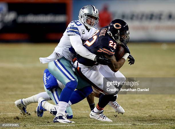 Running back Matt Forte of the Chicago Bears is tackled by middle linebacker Sean Lee of the Dallas Cowboys during a game at Soldier Field on...