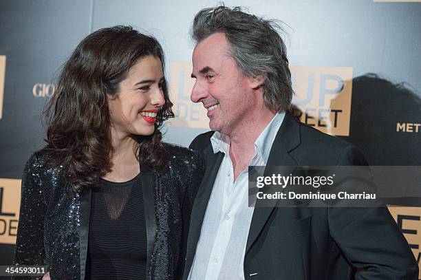 Jean-Christophe Grange and friend attend 'The Wolf of Wall Street' photocall at Palais Brogniart on December 9, 2013 in Paris, France.