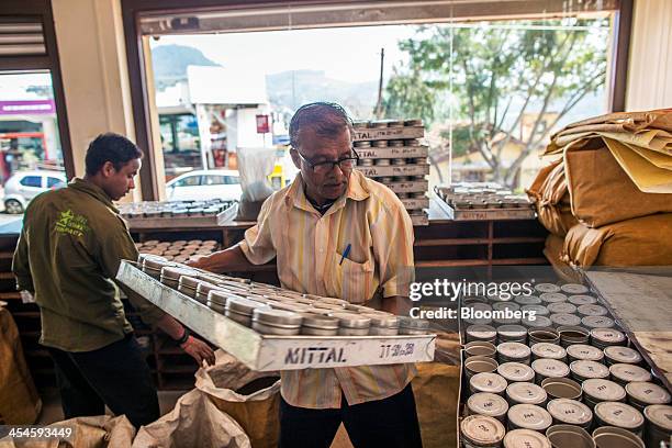 Employees sort tea samples at the Santosh Tea Industries Pvt. Office in Coonoor, Tamil Nadu, India, on Saturday, Nov. 30, 2013. India is the worlds...
