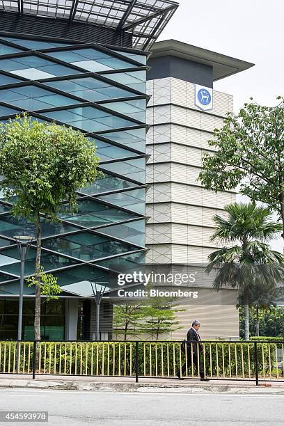 Pedestrian walks past Sasana Kijang, Bank Negara Malaysia's finance sector study center and venue for the Global Islamic Finance Forum, in Kuala...