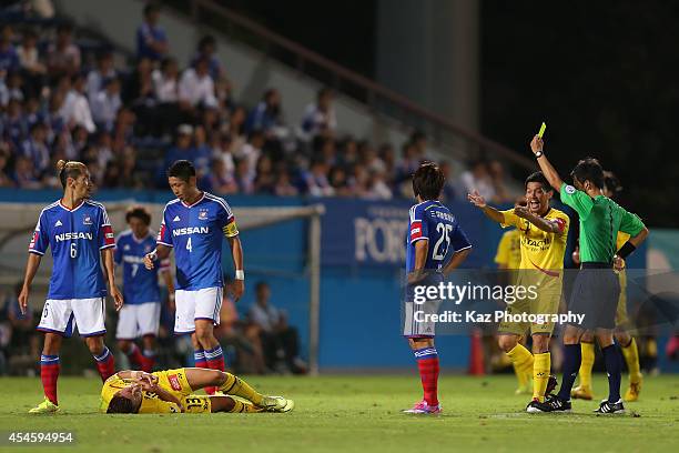 Yuzo Kurihara is given a second yellow card after bringing down Kaoru Takayama of Kashiwa Reysol during the J.League Yamazaki Nabisco Cup semi-final...