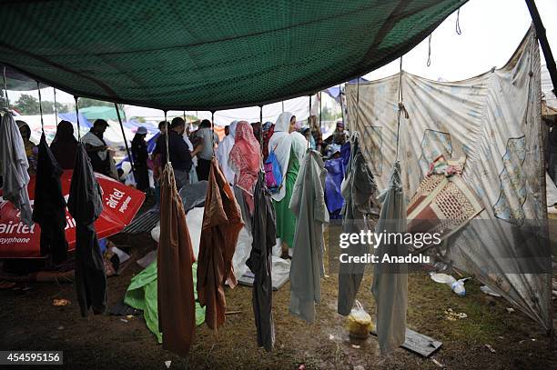 Laundry of Pakistani anti-government protestors are hung out on a tent during their waiting at the parliament garden within the ongoing protests in...