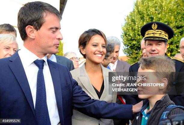 French Prime Minister Manuel Valls flanked by France's newly appointed Education Minister Najat Vallaud-Belkacem and Meurthe-et-Moselle prefect...