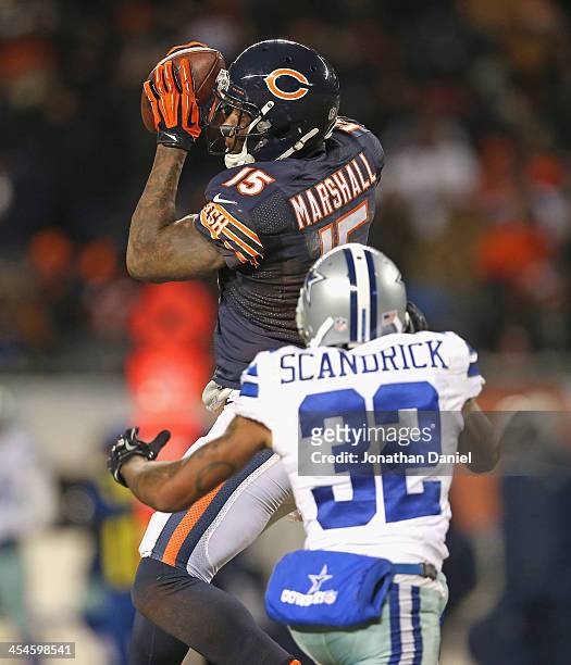 Brandon Marshall of the Chicago Bears makes a first down catch over Orlando Scandrick of the Dallas Cowboys at Soldier Field on December 9, 2013 in...