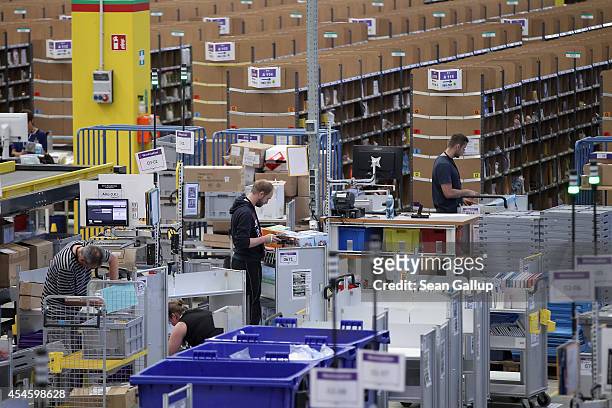 Workers process incoming inventory at an Amazon warehouse on September 4, 2014 in Brieselang, Germany. Germany is online retailer Amazon's second...