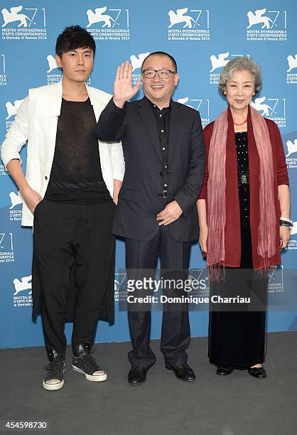 Actor Qin Hao, director Wang Xiaoshuai and actress Lu Zhong attend the 'Red Amnesia' photocall during the 71st Venice Film Festival at Palazzo del...