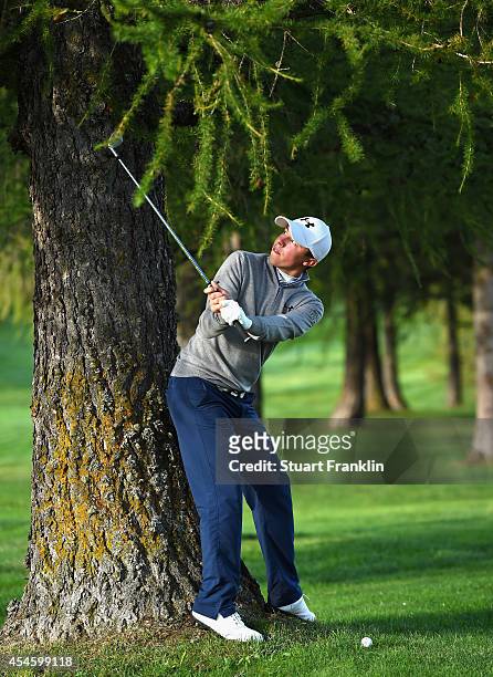 Matthew Fitzpatrick of England plays a shot during the first round of the Omega European Masters at Crans-sur-Sierre Golf Club on September 4, 2014...