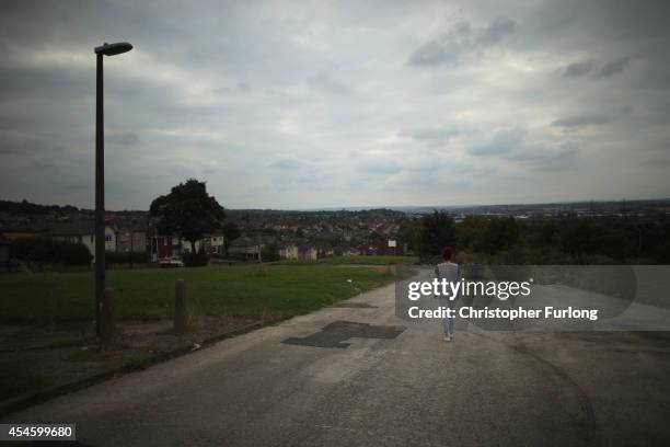 Teenage girl, who claims to be a victim of sexual abuse and alleged grooming, poses in Rotherham on September 3, 2014 in Rotherham, England. South...