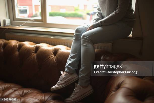 Teenage girl, who claims to be a victim of sexual abuse and alleged grooming, poses in Rotherham on September 3, 2014 in Rotherham, England. South...