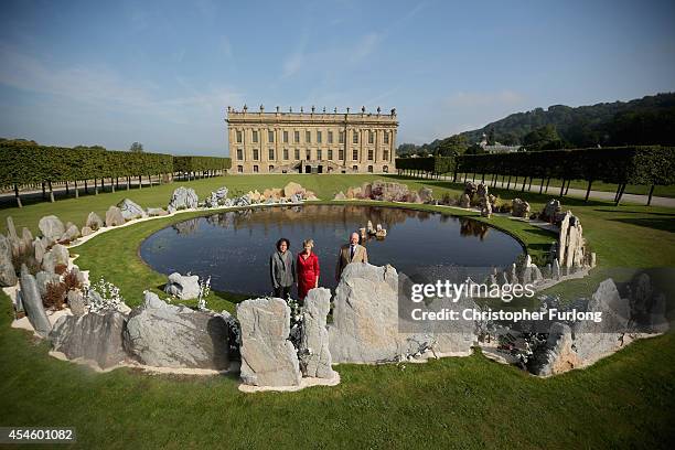 The Duke and Duchess of Devonshire and artist Xu Bing view his work Tao Huan Yuan: A lost village Utopia, in front of Chatsworth House which is part...