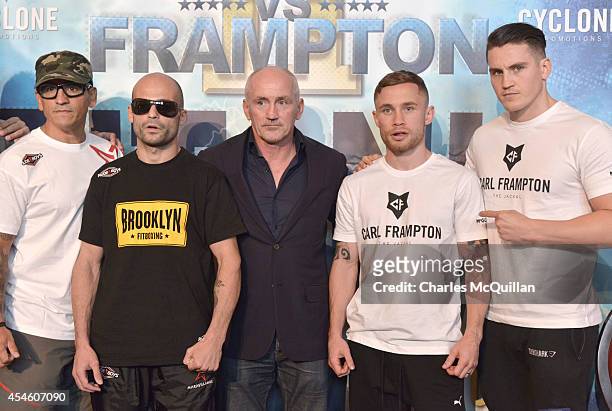 The IBF super-bantamweight world champion Kiko Martinez and the number one contender Carl Frampton pose with Barry McGuigan during a pre-fight press...