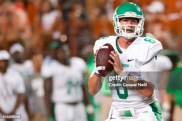 Josh Greer of the North Texas Mean Green drops back to pass against ...