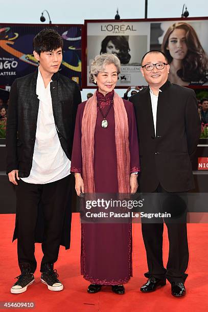 Actors Qin Hao, Lu Zhong and director Wang Xiaoshuai attend 'Red Amnesia' Premiere during the 71st Venice Film Festival on September 4, 2014 in...