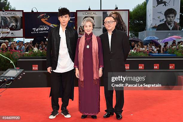 Actors Qin Hao, Lu Zhong and director Wang Xiaoshuai attend 'Red Amnesia' Premiere during the 71st Venice Film Festival on September 4, 2014 in...