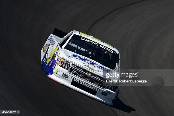 Jason White, driver of the Autism Speaks/NTS Motorsports Chevrolet, drives during practice for the NASCAR Camping World Truck Series Careers for...