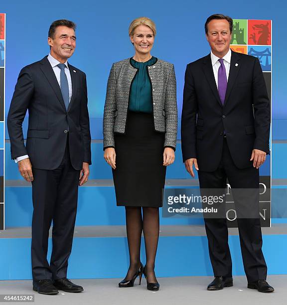 Secretary General Anders Fogh Rasmussen , Danish Prime Minister Helle Thorning-Schmidt and British Prime Minister David Cameron pose for...