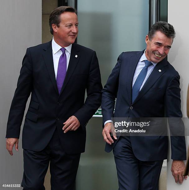 Secretary General Anders Fogh Rasmussen and British Prime Minister David Cameron arrive for the welcoming ceremony at the NATO Summit 2014 at the...