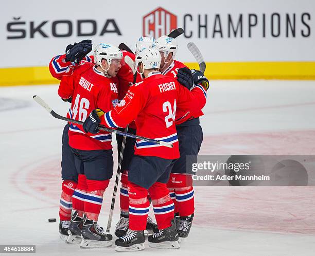 Adler celebrate the first goal during the Champions Hockey League group stage game between Adler Mannheim and KalPa Kuopio on September 4, 2014 in...
