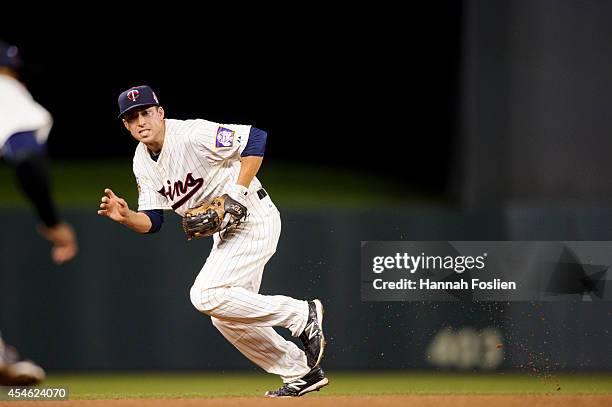 Doug Bernier of the Minnesota Twins makes a play at shortstop against the Chicago White Sox during the game on September 3, 2014 at Target Field in...