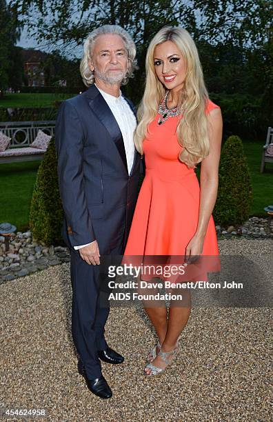 Hermann Buehlbecker and Rosanna Davison attend the Woodside End of Summer party to benefit the Elton John AIDS Foundation sponsored by Chopard and...