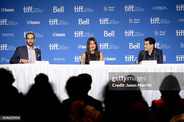 Moderator Mohit Rajhans, actress Priyanka Chopra and director Omung Kumar speak onstage at the "Mary Kom" Press Conference during the 2014 Toronto...