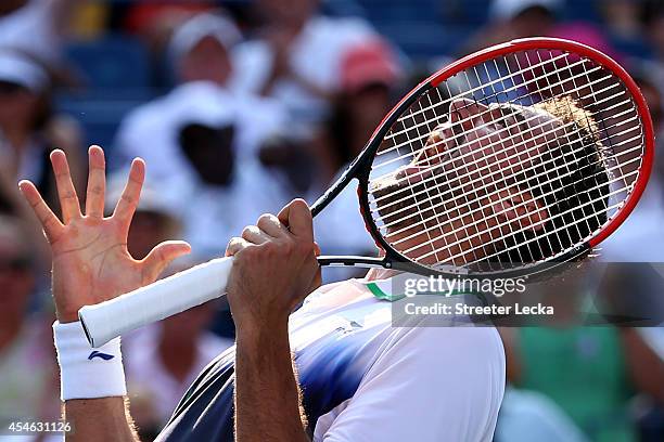 Marin Cilic of Croatia reacts after defeating Tomas Berdych of the Czech Republic during their men's singles quarterfinal match on Day Eleven of the...