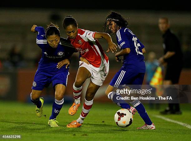 Rachel Yankey of Arsenal holds off pressure from Yuki Ogimi of Chelsea during the WSL match between Arsenal Ladies and Chelsea Ladies at Borehamwood...