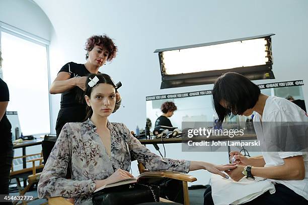 Models prepare backstage at theCostello Tagliapietra during MADE Fashion Week Spring 2015 at Milk Studios on September 4, 2014 in New York City.