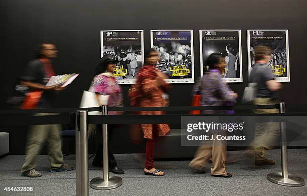 Members of the media line up to enter a press conference at the TIFF Bell Lightbox during day one of the 2014 Toronto Film Festival on September 4,...