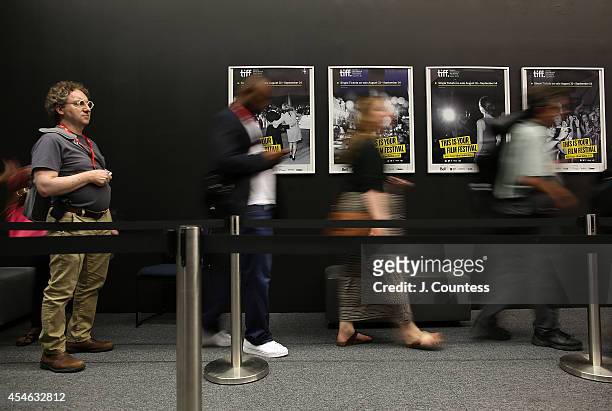 Members of the media line up to enter a press conference at the TIFF Bell Lightbox during day one of the 2014 Toronto Film Festival on September 4,...