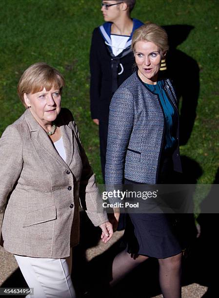 German Chancellor Angela Merkel and Danish Prime Minister Helle Thorning-Schmidt arrived for a NATO Summit dinner at Cardiff Castle on September 4,...