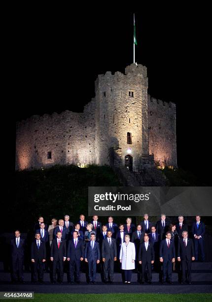 President Barack Obama, British Prime Minister David Cameron and NATO Secretary General Anders Fogh Rasmussen pose with other leaders and senior...