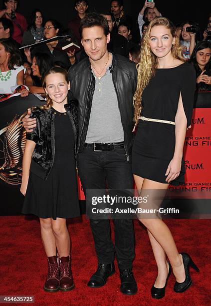 Actor Peter Facinelli and daughters Luca Bella Facinelli and Lola Ray Facinelli arrive at the Los Angeles Premiere of 'The Hunger Games: Catching...