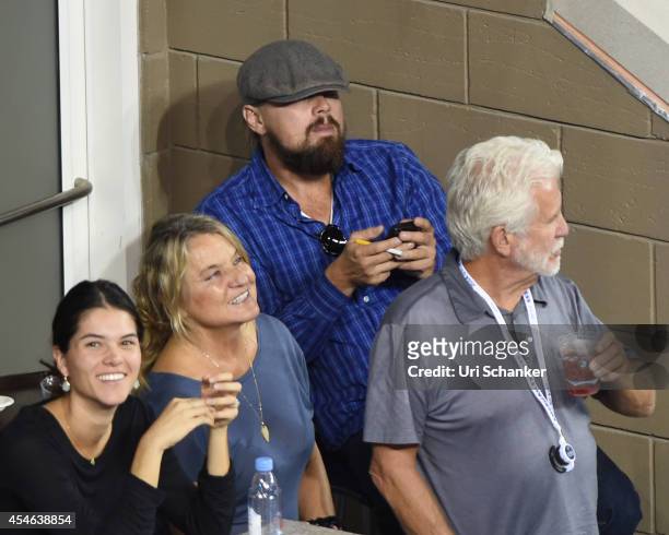 Leonardo DiCaprio and his mother Irmelin Indenbirken attend day 10 of the 2014 US Open at USTA Billie Jean King National Tennis Center on September...