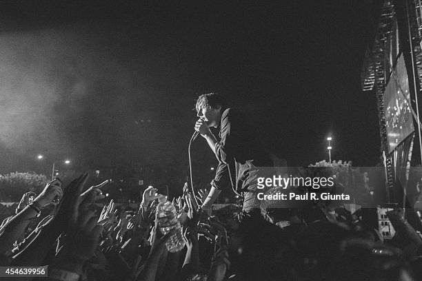 Thomas Mars of Phoenix performs onstage at LA Sports Arena & Exposition Park on August 24, 2014 in Los Angeles, California.