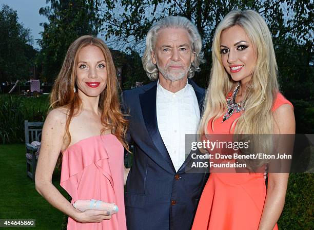 Linda van der Steen, Hermann Buehlbecker and Rosanna Davison attend the Woodside End of Summer party to benefit the Elton John AIDS Foundation...