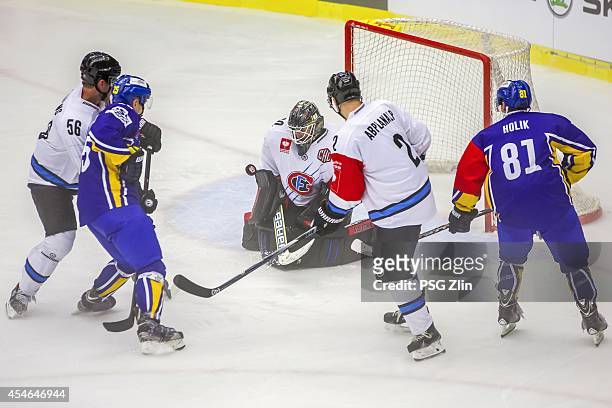 Timo Helbling, Marc Abplanalp of Fribourg-Gotteron, Petr Holik, Pavel Kubis of PSG Zlin Champions Hockey League group stage game between PSG Zlin and...