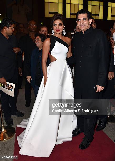 Actress Priyanka Chopra and director Omung Kumar attend the "Mary Kom" premiere during the 2014 Toronto International Film Festival at The Elgin on...