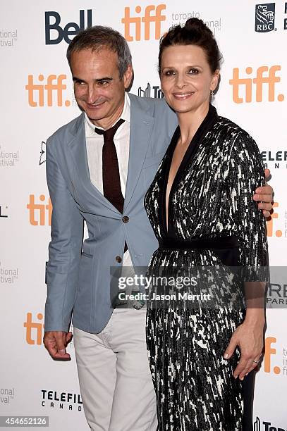 Writer/director Olivier Assayas and actress Juliette Binoche attend the "Clouds Of Sils Maria" premiere during the 2014 Toronto International Film...