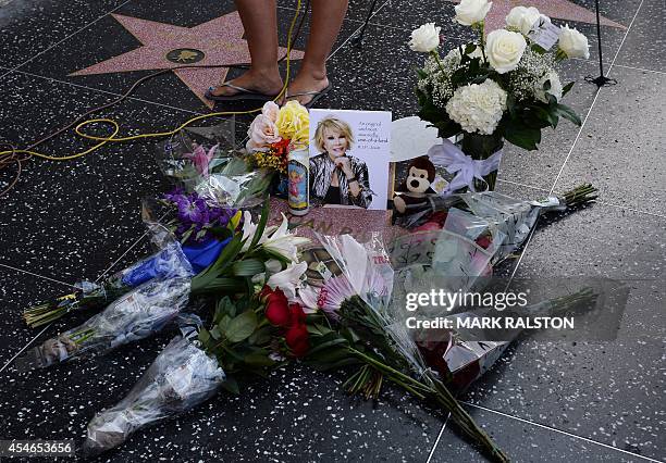 Flowers are placed on the Hollywood Walk of Fame Star for Joan Rivers in Hollywood, California on September 4 following news of the comedian's death...