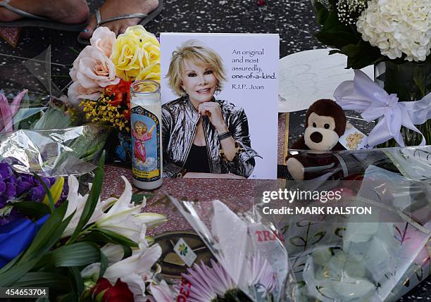 Flowers are placed on the Hollywood Walk of Fame Star for Joan Rivers in Hollywood, California on September 4 following news of the comedian's death...