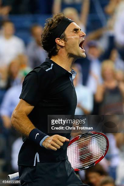 Roger Federer of Switzerland celebrates after defeating Gael Monfils of France during their men's singles quarterfinal match on Day Eleven of the...