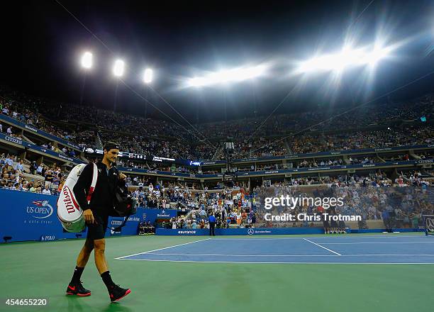 Roger Federer of Switzerland walks on to the court prior to his match against Gael Monfils of France in their men's singles quarterfinal match on Day...