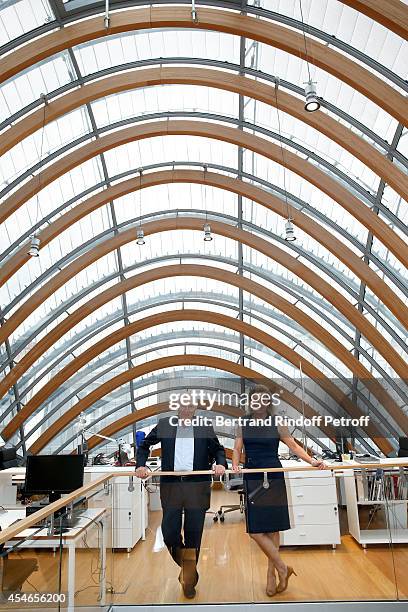 Pathe Jerome Seydoux and his wife CEO of the 'Jerome Seydoux - Pathe Foundation' Sophie Seydoux pose in the library during the 'Jerome Seydoux -...