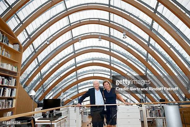 Pathe Jerome Seydoux and his wife CEO of the 'Jerome Seydoux - Pathe Foundation' Sophie Seydoux pose in the library during the 'Jerome Seydoux -...