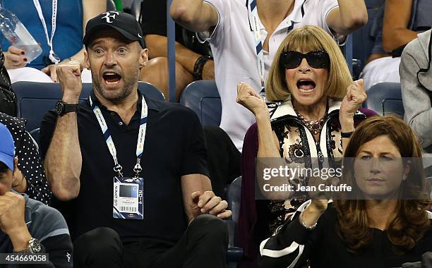 Hugh Jackman and Anna Wintour attend the match between Roger Federer of Switzerland and Gael Monfils of France during Day 11 of the 2014 US Open at...