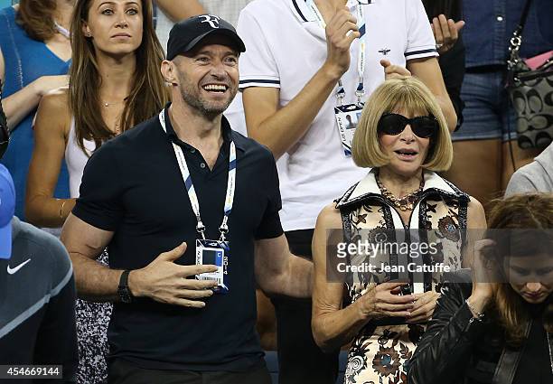 Hugh Jackman and Anna Wintour attend the match between Roger Federer of Switzerland and Gael Monfils of France during Day 11 of the 2014 US Open at...