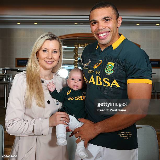 Bryan Habana poses with his wife Janine and son Timothy before the South Africa Springboks captain's run at the Duxton Hotel on September 5, 2014 in...