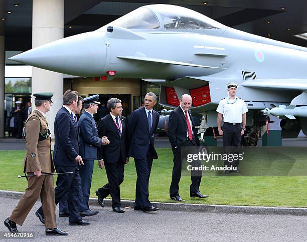 President Barack Obama , British Prime Minister David Cameron , President of Romania Traian Basesku and NATO Secretary General Anders Fogh Rasmussen...